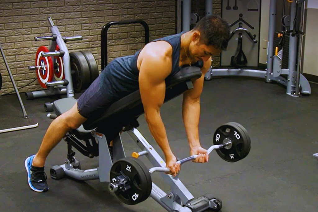 A man performing Ez Bar Spider Curl