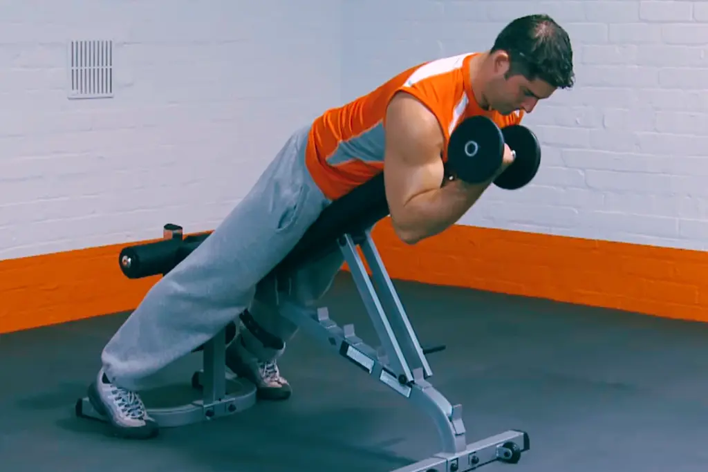 A man doing Dumbbell Spider Curl