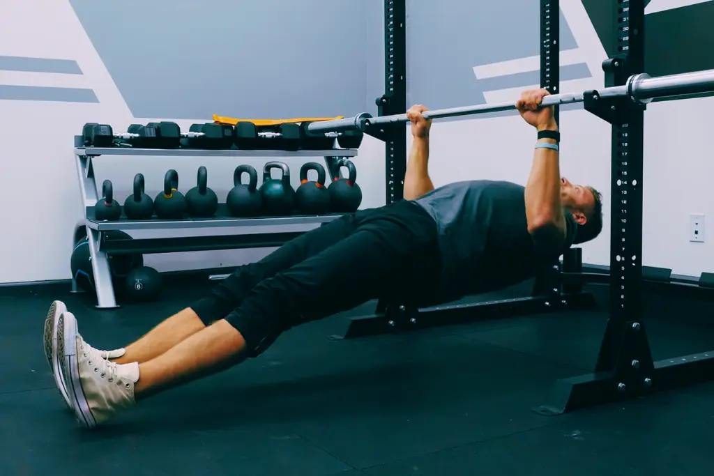 a man doing Inverted Row